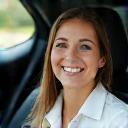 Marisol smiling in her new car